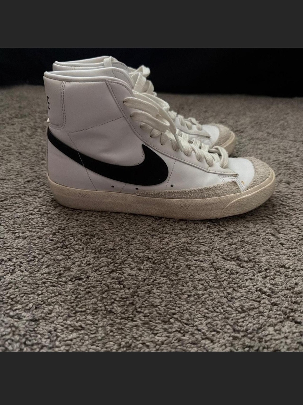 Nike White High-Top Sneakers with Black Swoosh